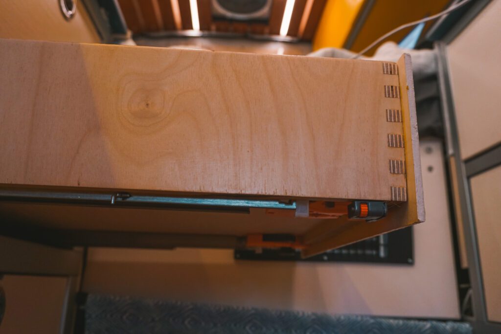 Under mount drawer slides on our finger jointed drawer boxes make for some great 80/20 van galley drawers!